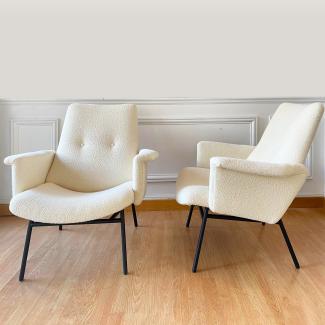 a pair of armchairs of Pierre Guariche