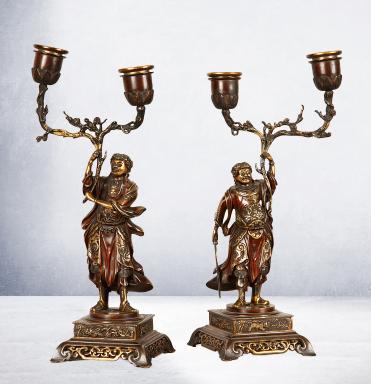 Pair of candlesticks in bronze with asian characters