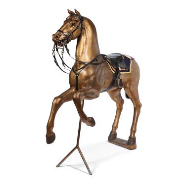 Harnessed golden wooden horse