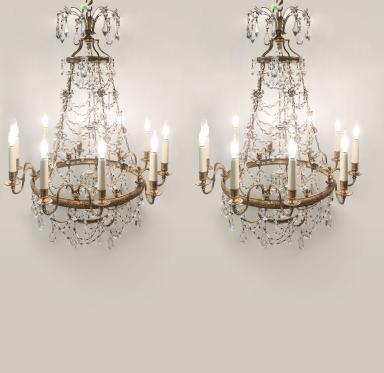Pair of crystal and brass chandeliers in the style of Louis XVI
