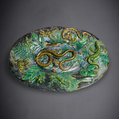 Oval dish with snakes and eel by Alfred Renoleau