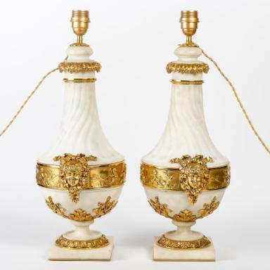 Pair of fluted marble and bronze urns in the style of Louis XVI, circa 1880. 