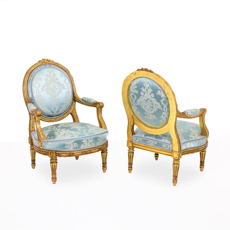 Pair of Louis XVI style armchairs in gilded wood, circa 1880