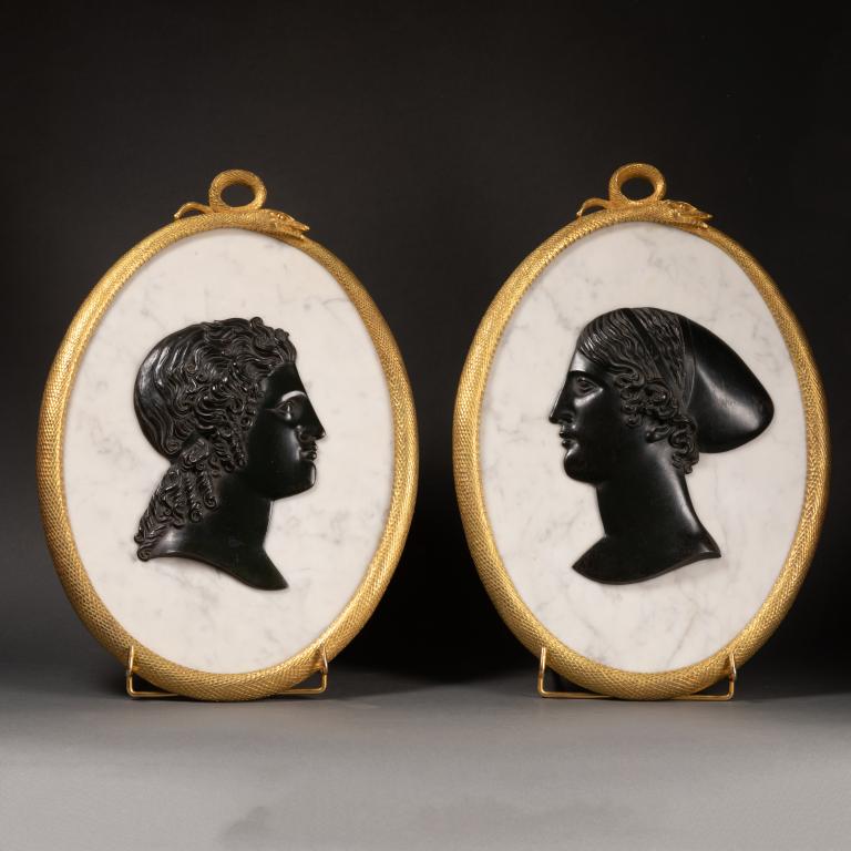 Pair of medallions representing profiles in the antique style
