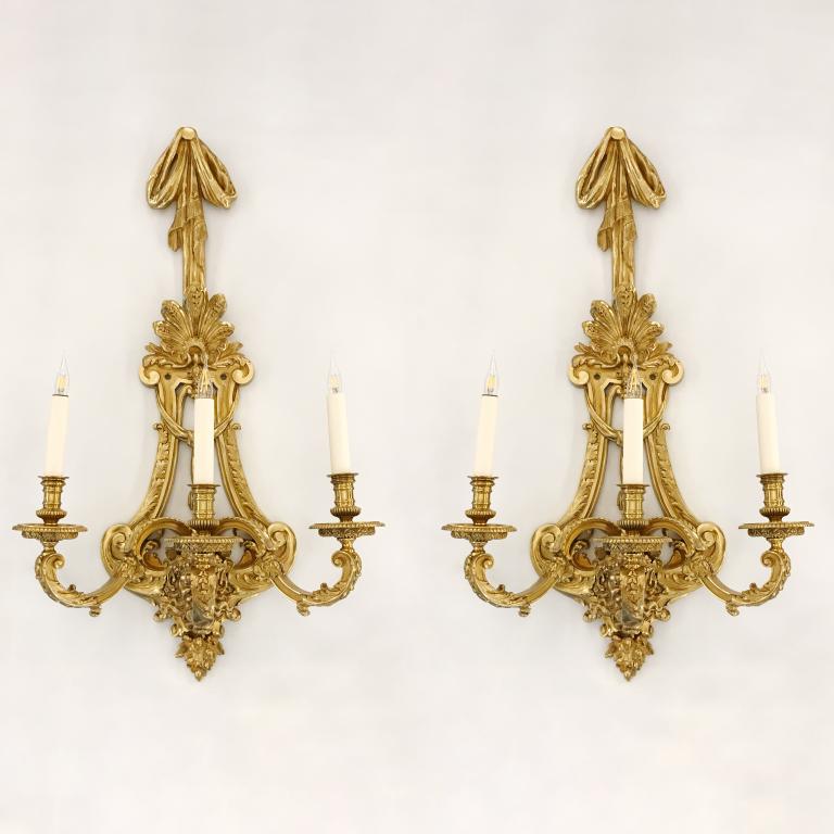 Suite of four large gilt bronze sconces in the Transitional style