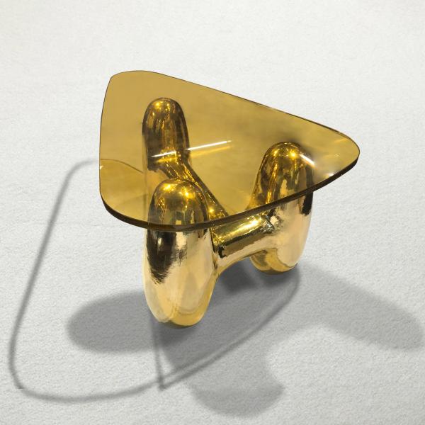 Gold-plated brass table with a resin top