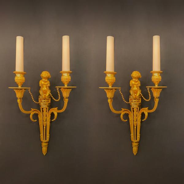 Pair of Louis XVI style gilt bronze wall lights