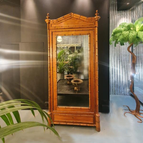 Cabinet in fir wood with imitation bamboo decoration.