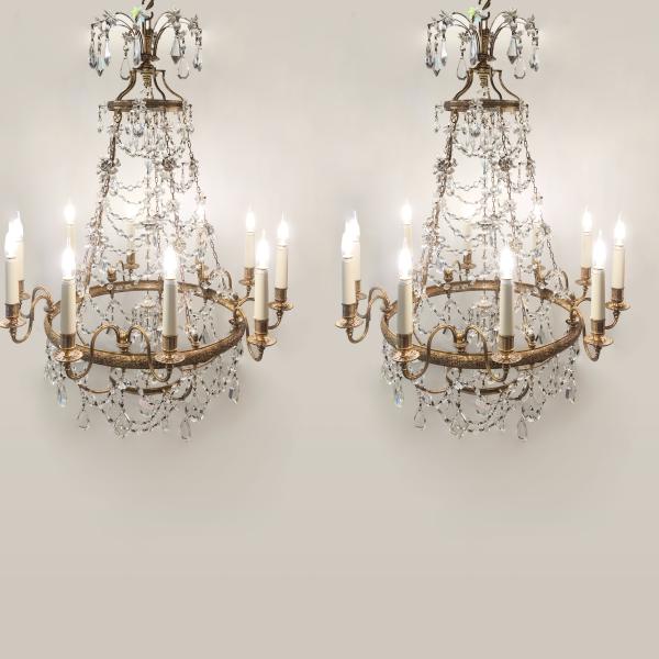 Pair of crystal and brass chandeliers in the style of Louis XVI