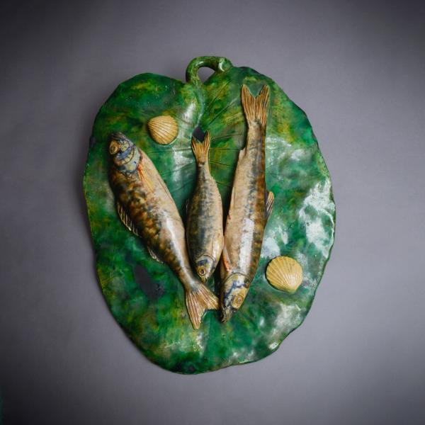 Green leaf with three fishes by the ceramist Alfred Renoleau